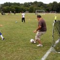 Nick plays soccer with Dad